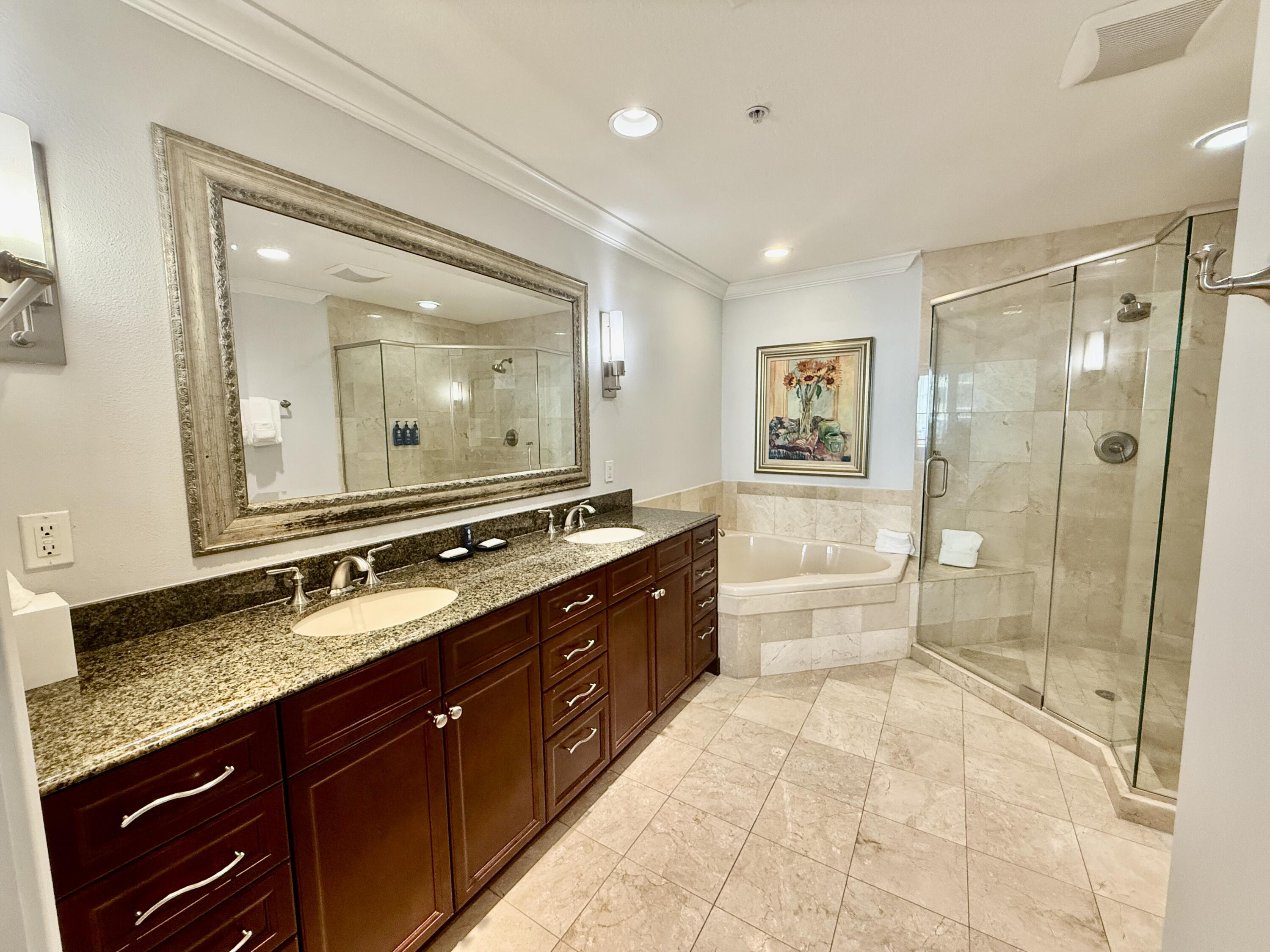 10 Harbor Boulevard, Unit E803G Destin, FL 32541 - Photo 18 of 28 a spacious bathroom with a double vanity sink mirror double and shower