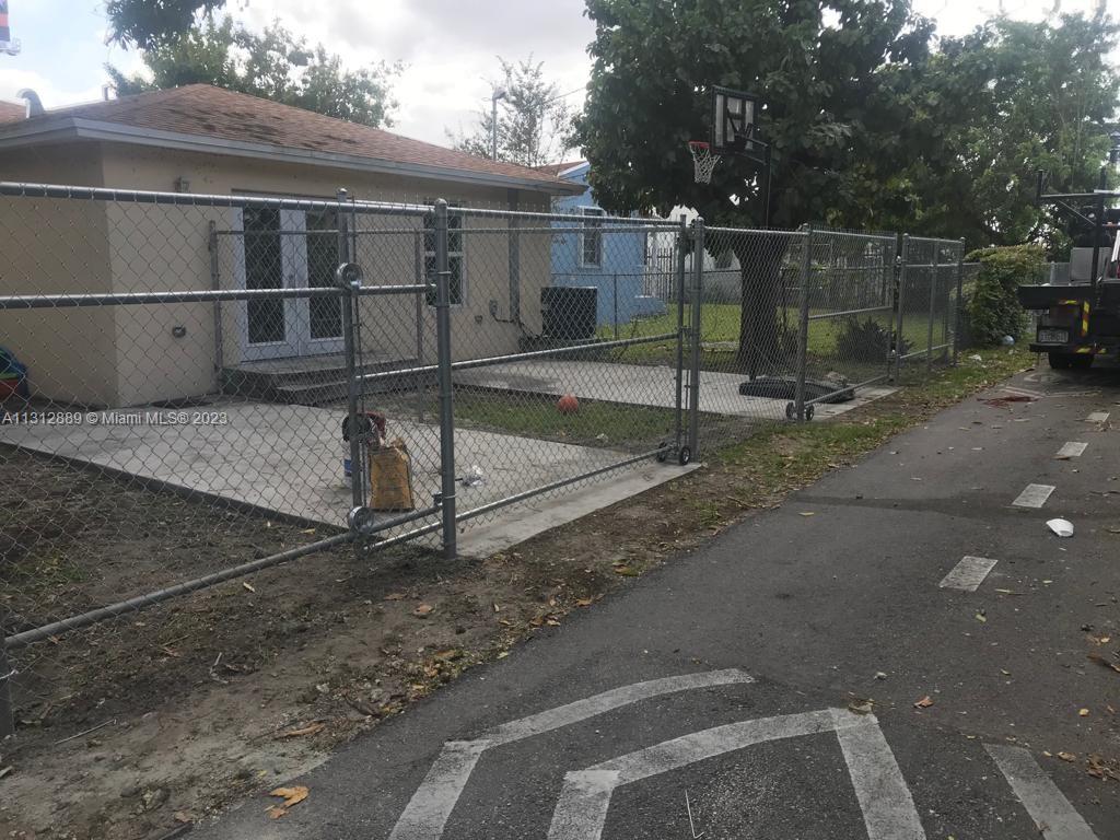 659 Northwest 47th Street, Unit 659 Miami, FL 33127 - Photo 2 of 9 a backyard of a house