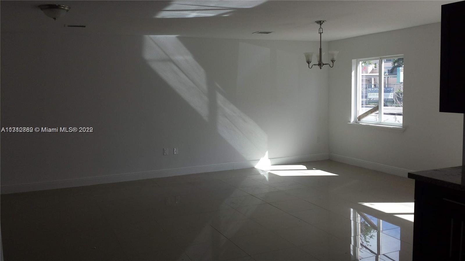 659 Northwest 47th Street, Unit 659 Miami, FL 33127 - Photo 6 of 9 a view of an empty room with a window