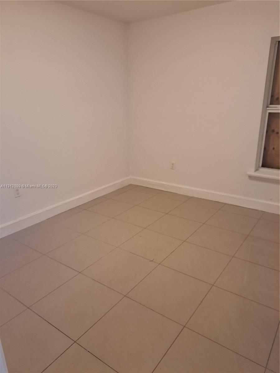659 Northwest 47th Street, Unit 659 Miami, FL 33127 - Photo 8 of 9 a view of an empty room