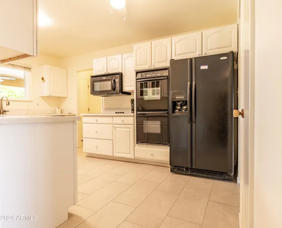 a kitchen with stainless steel appliances a refrigerator and a stove