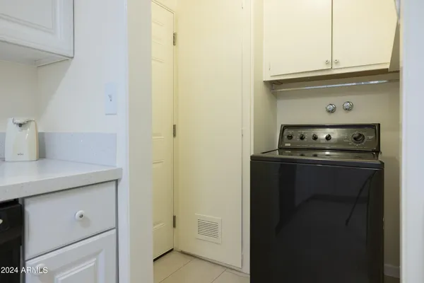a kitchen with a stove and a refrigerator