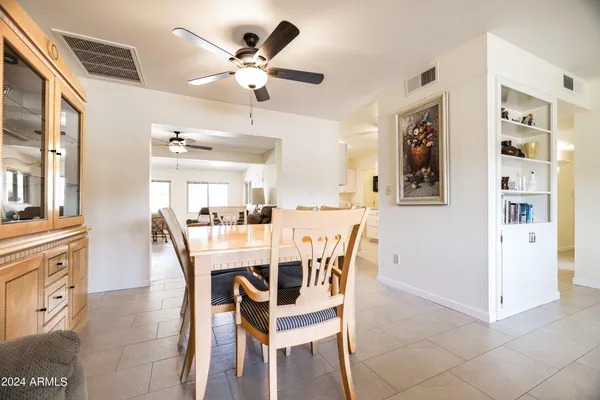 a dining room with furniture and window