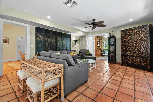 a kitchen with stainless steel appliances granite countertop a refrigerator a sink a stove and a window