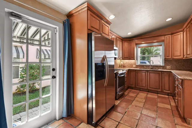 a kitchen with a sink and a window