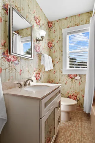 a view of a yard with plants and trees