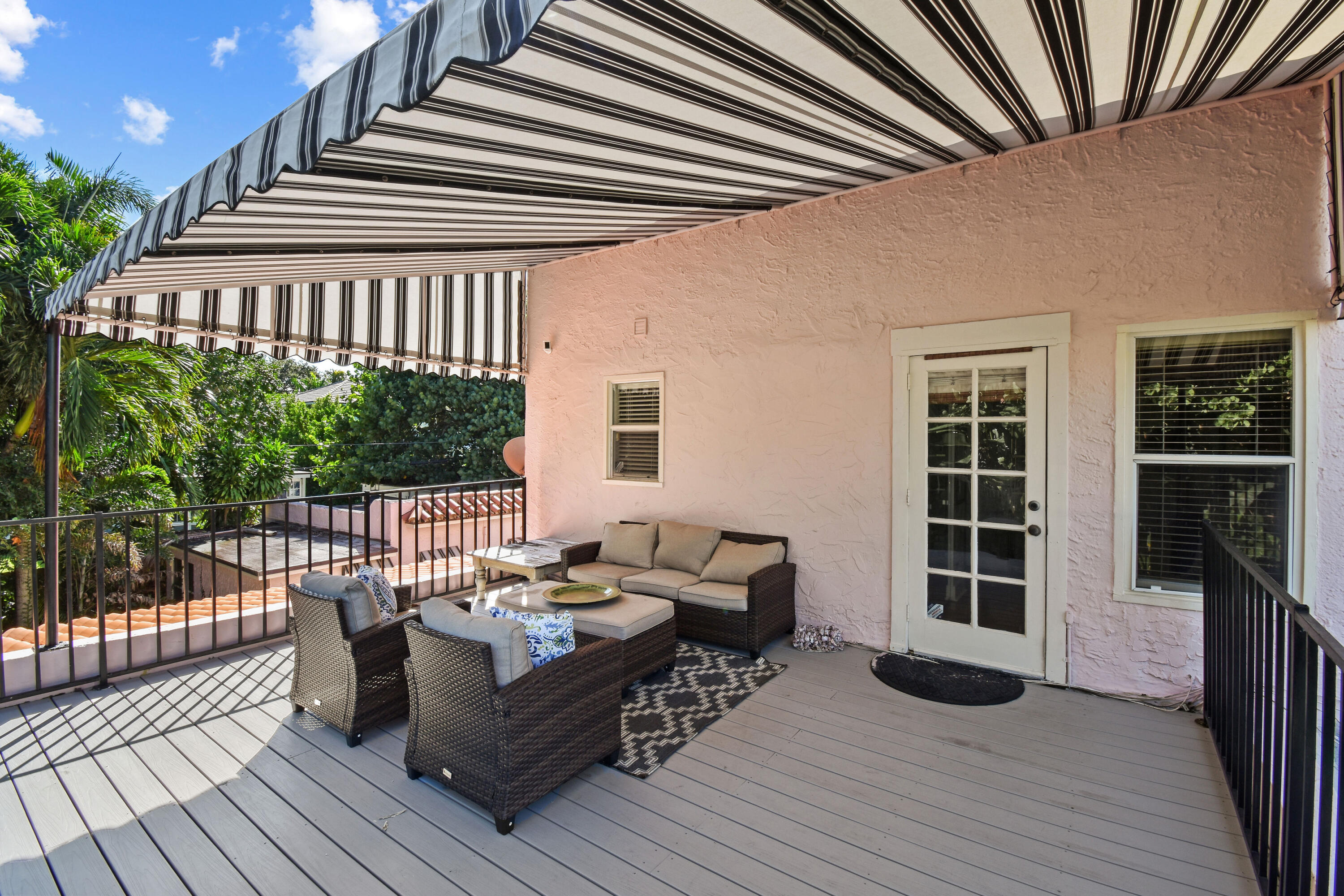 194 Almeria Road West Palm Beach, FL 33405 - Photo 56 of 67 a balcony with furniture and wooden floor