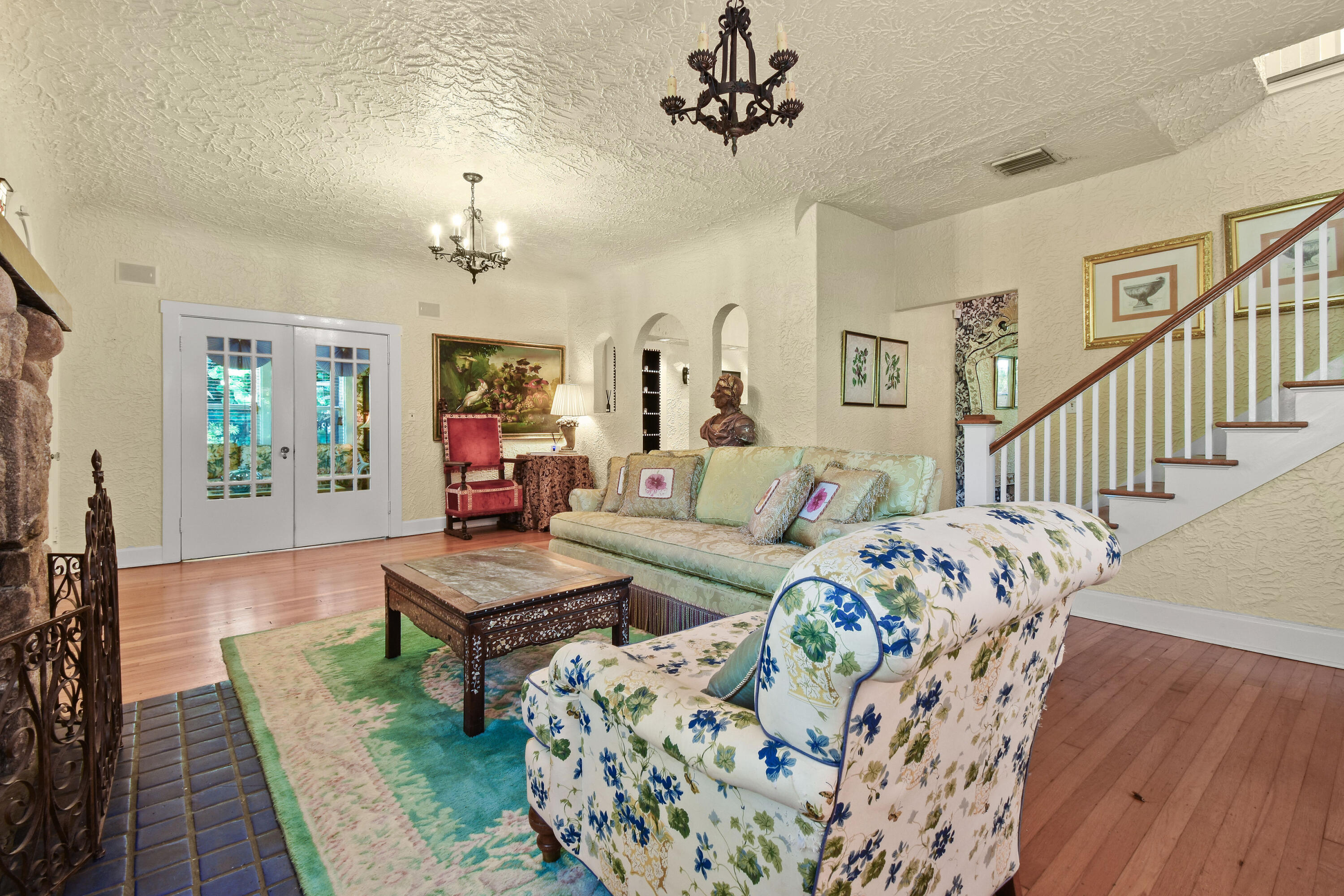 194 Almeria Road West Palm Beach, FL 33405 - Photo 8 of 67 a living room with furniture and a chandelier