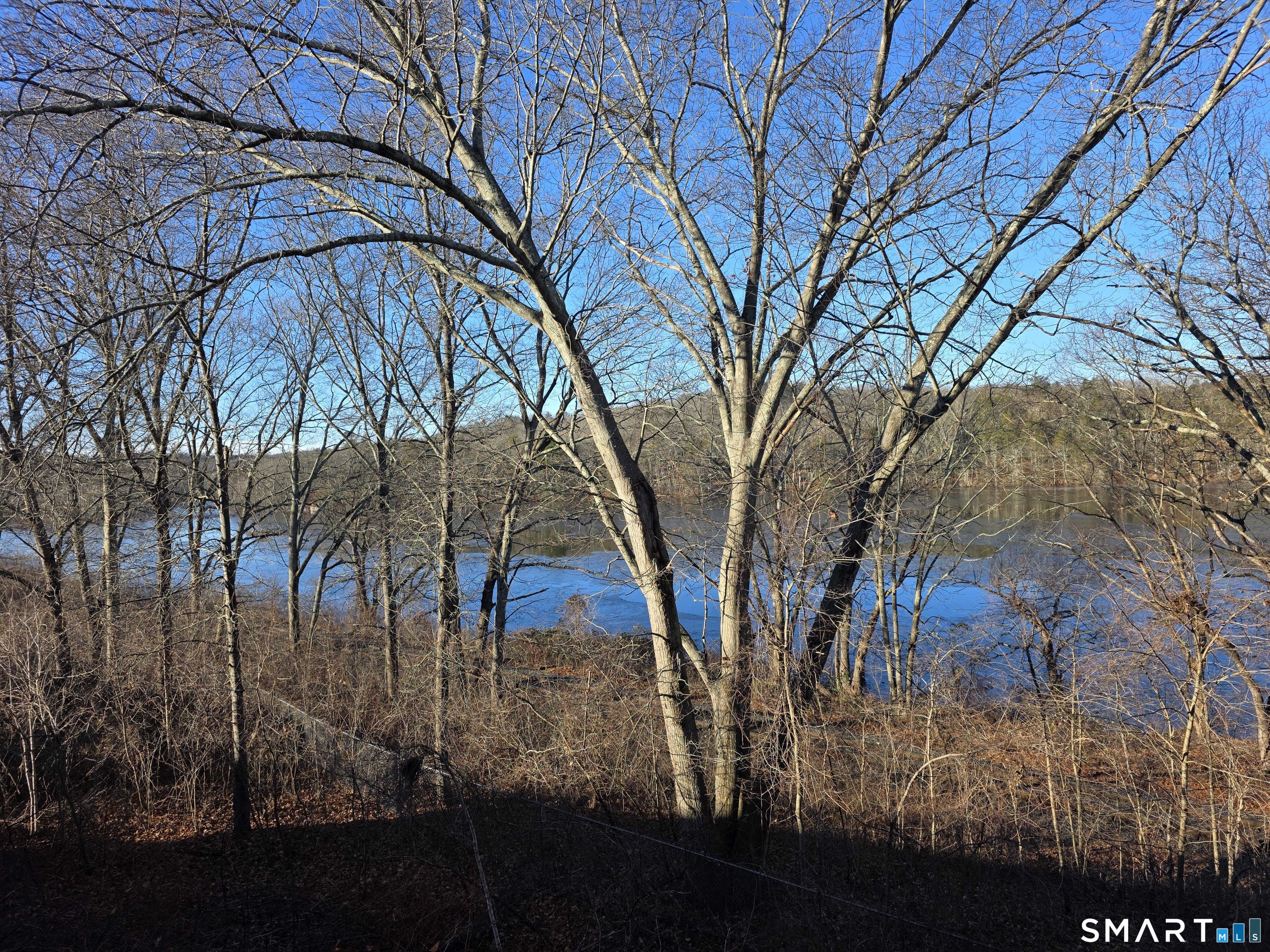 148 Mathewson Street, Unit 609 Griswold, CT 06351 - Photo 12 of 23 a view of outdoor space with lots of trees