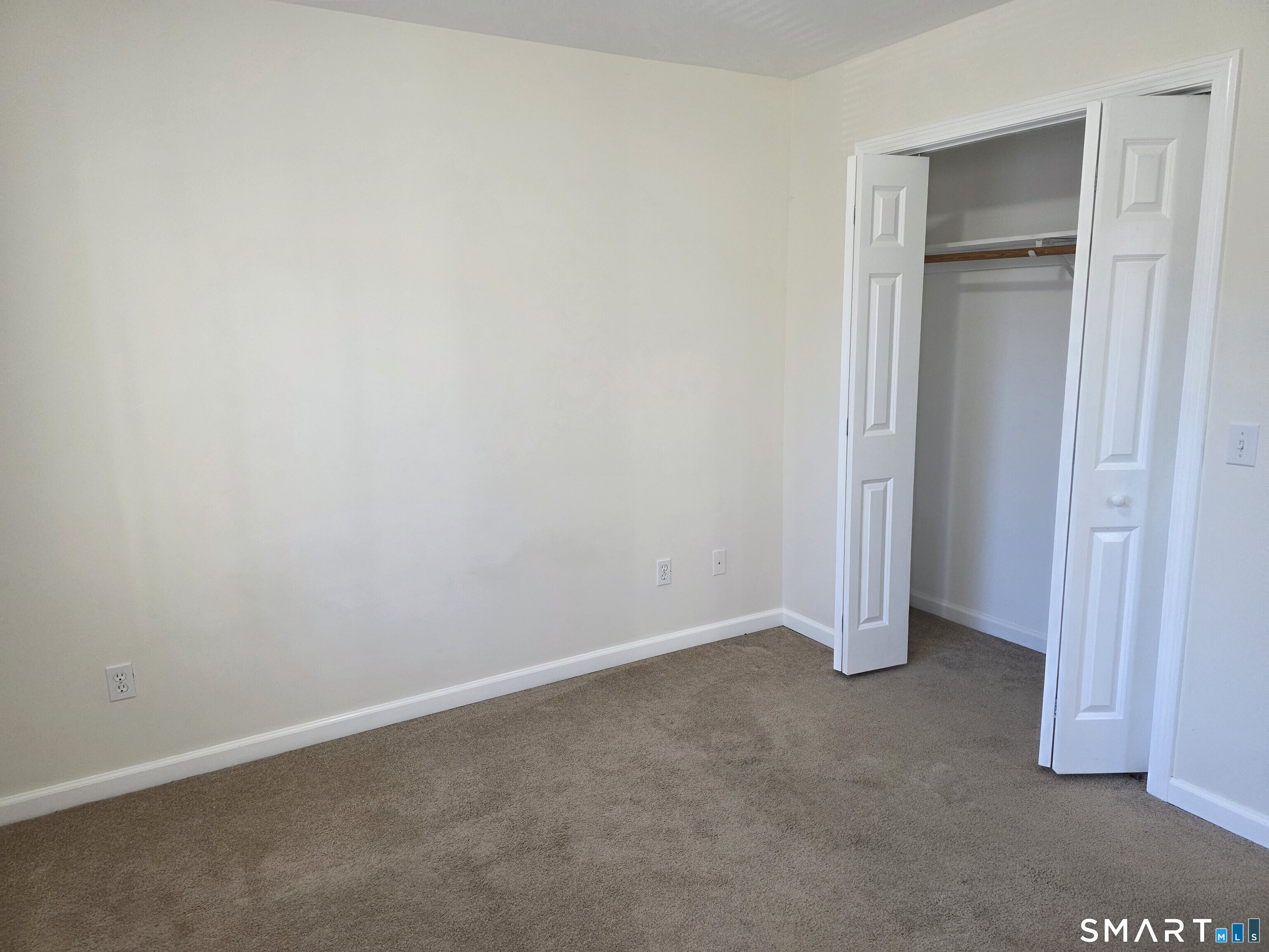 148 Mathewson Street, Unit 609 Griswold, CT 06351 - Photo 18 of 23 an empty room with closet area