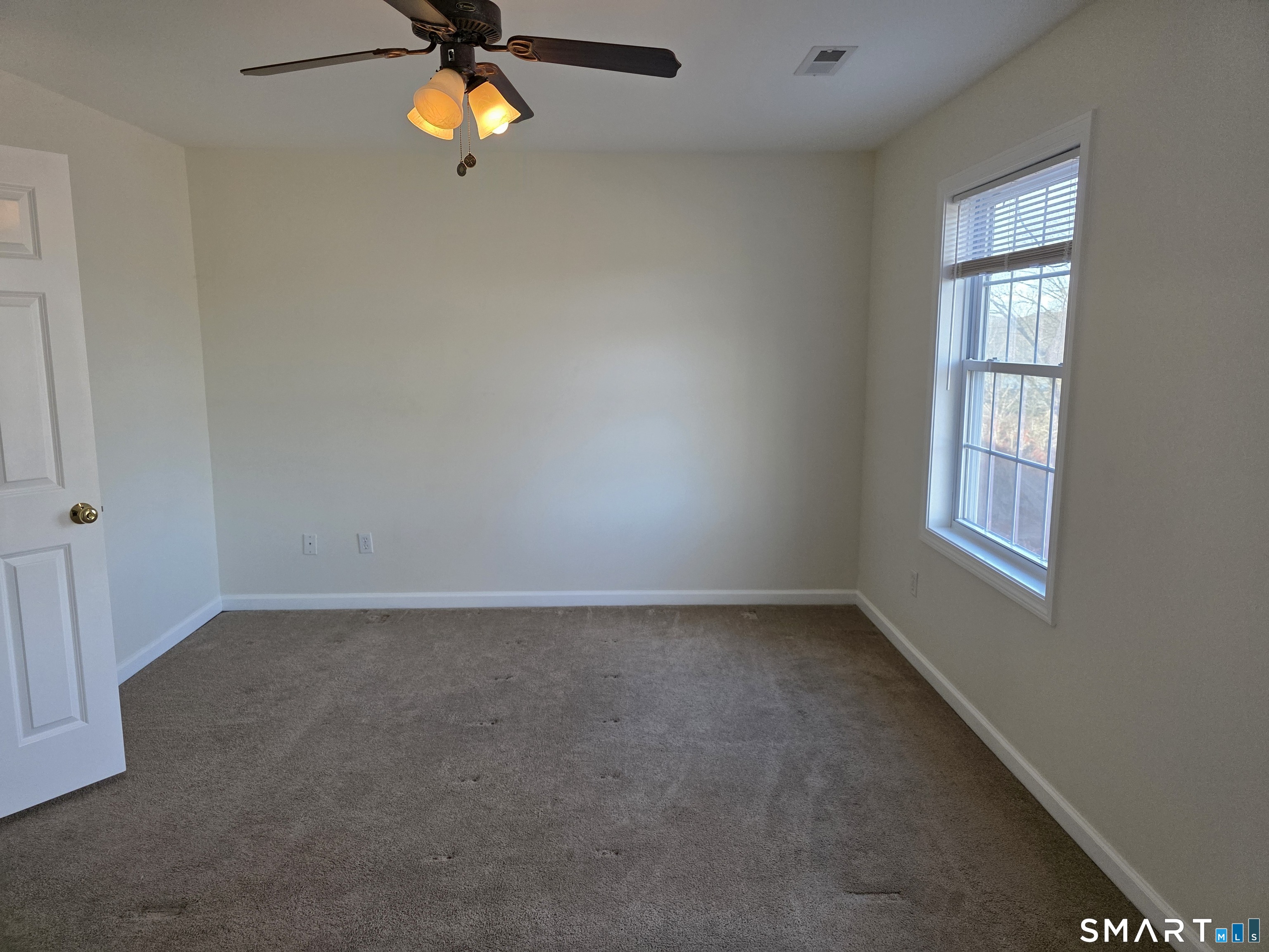 148 Mathewson Street, Unit 609 Griswold, CT 06351 - Photo 20 of 23 an empty room with windows and window