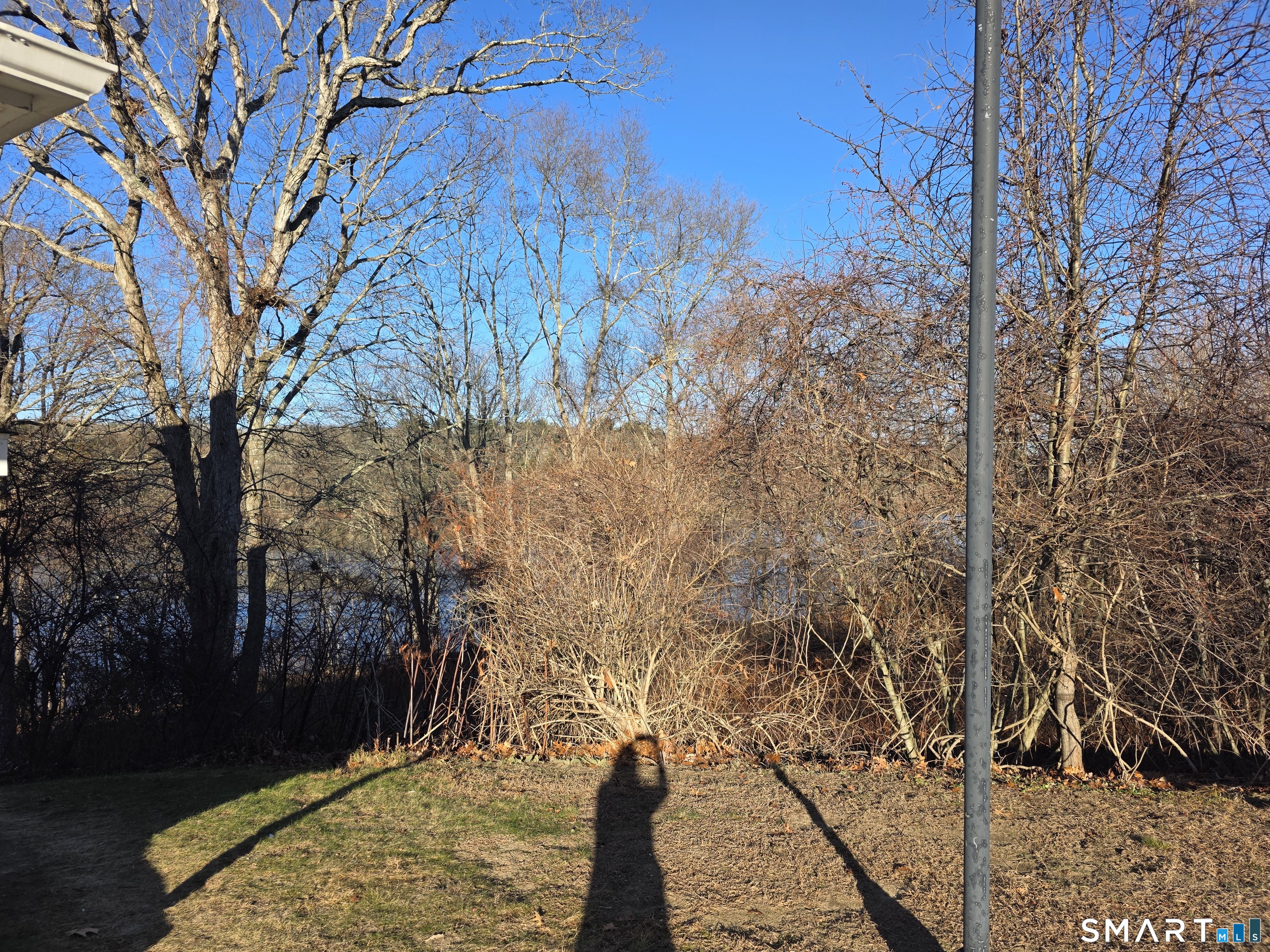 148 Mathewson Street, Unit 609 Griswold, CT 06351 - Photo 2 of 23 a view of a yard with wooden fence