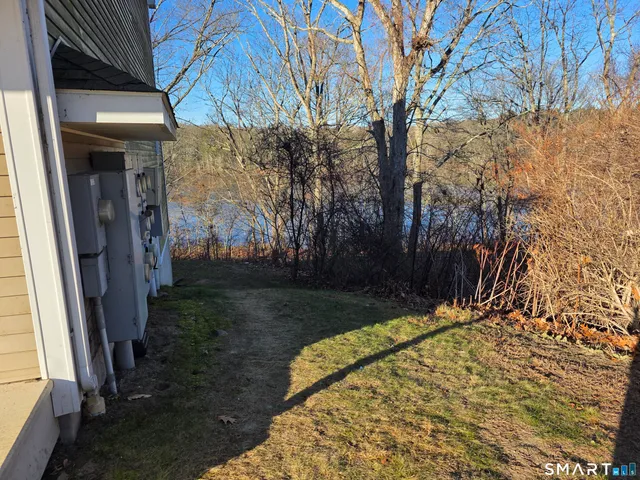 a view of backyard with patio