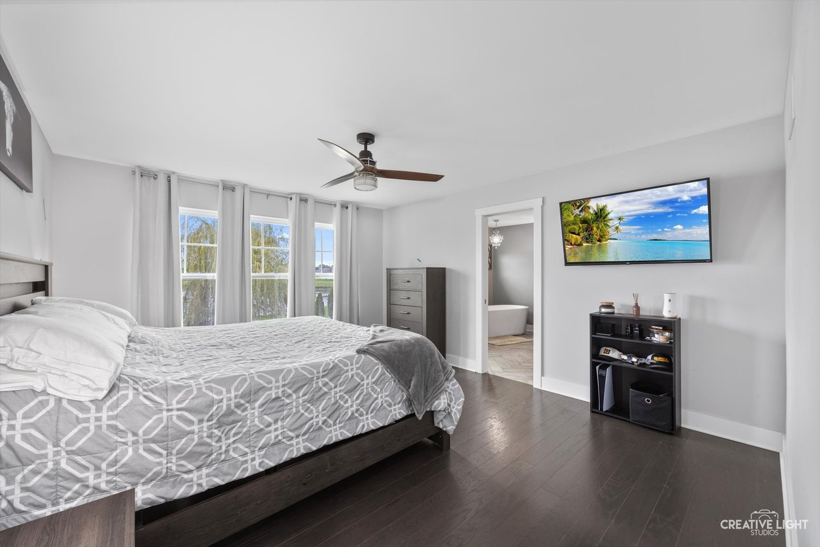 618 Peacock Place Manteno, IL 60950 - Photo 19 of 31 a bedroom with a bed and a chandelier