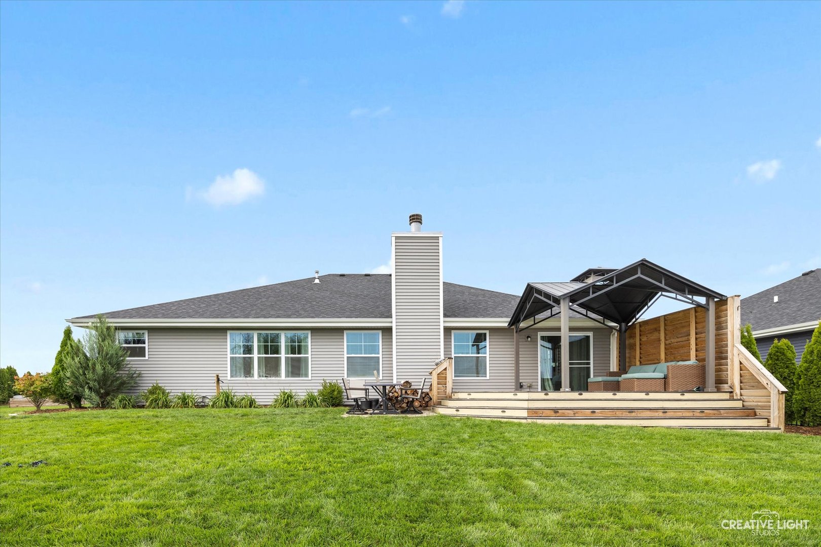 618 Peacock Place Manteno, IL 60950 - Photo 30 of 31 a front view of a house with a garden and yard