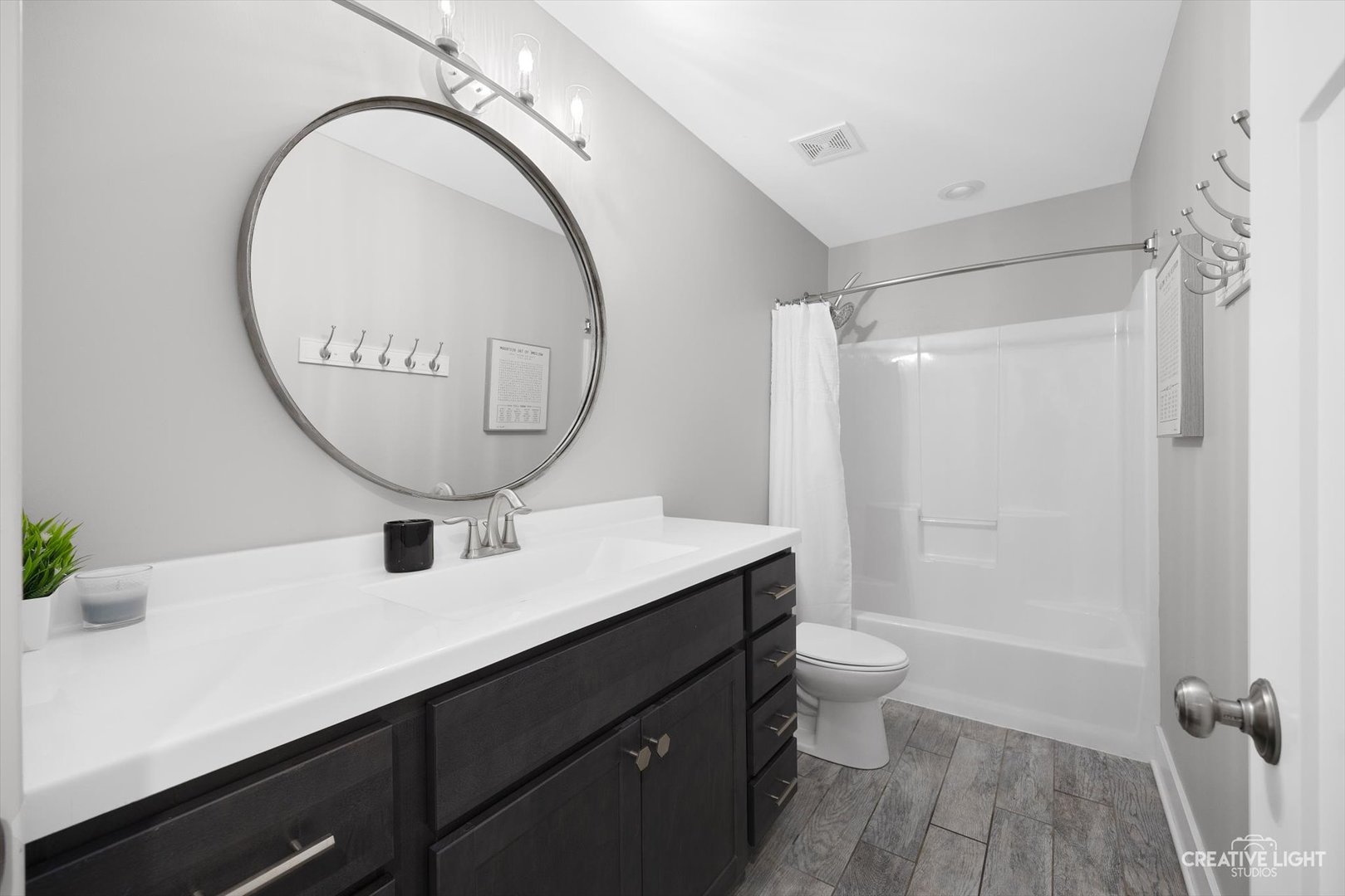 618 Peacock Place Manteno, IL 60950 - Photo 8 of 31 a bathroom with a sink a toilet and a mirror