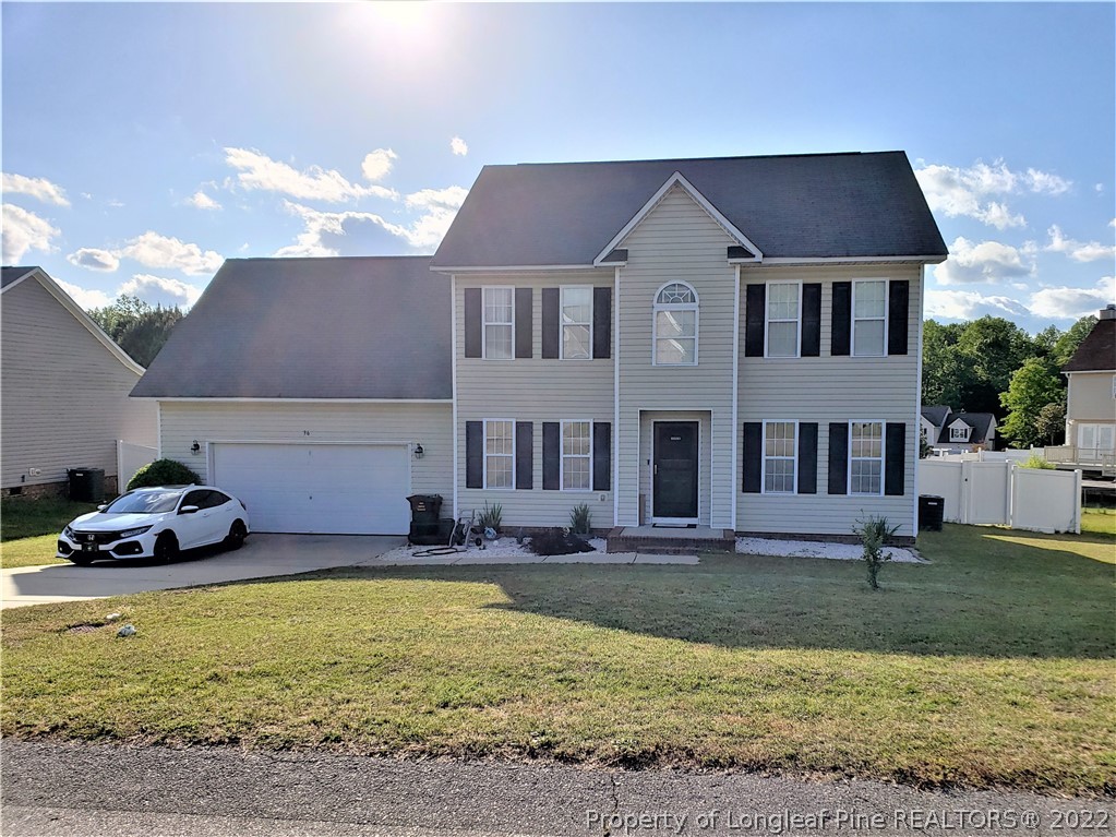 36 Pender Road Spring Lake, NC 28390 - Photo 1 of 7 a front view of a house with a yard outdoor seating and covered with trees