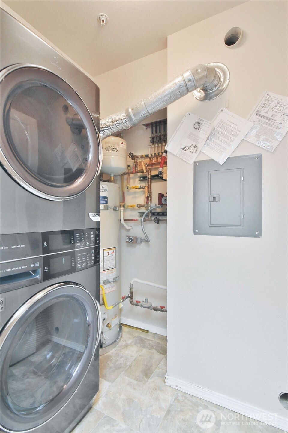 8500 Main Street, Unit F313 Edmonds, WA 98026 - Photo 22 of 24 a utility room with a sink washer and dryer