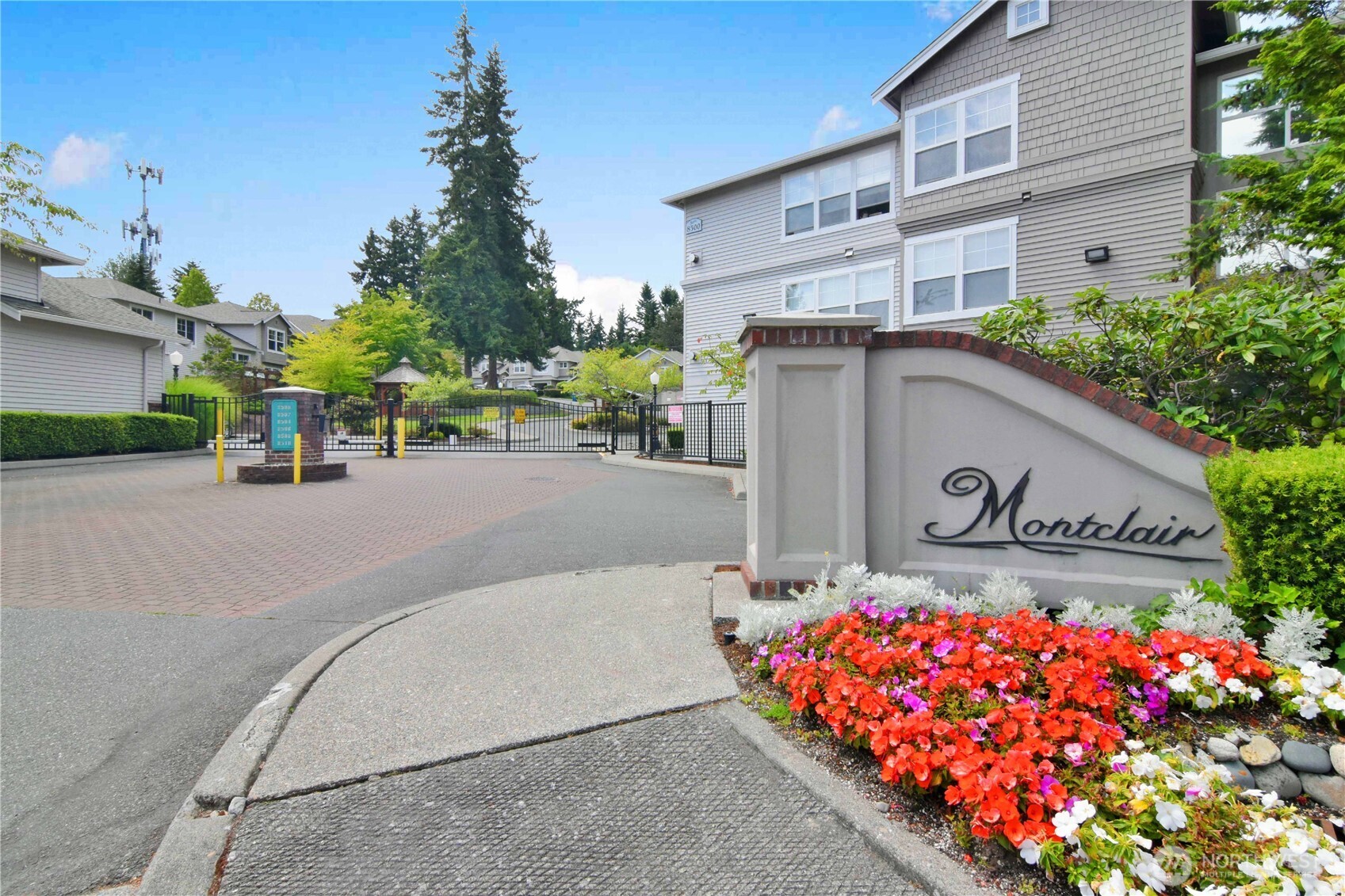 8500 Main Street, Unit F313 Edmonds, WA 98026 - Photo 23 of 24 a street view with tall buildings and a street sign
