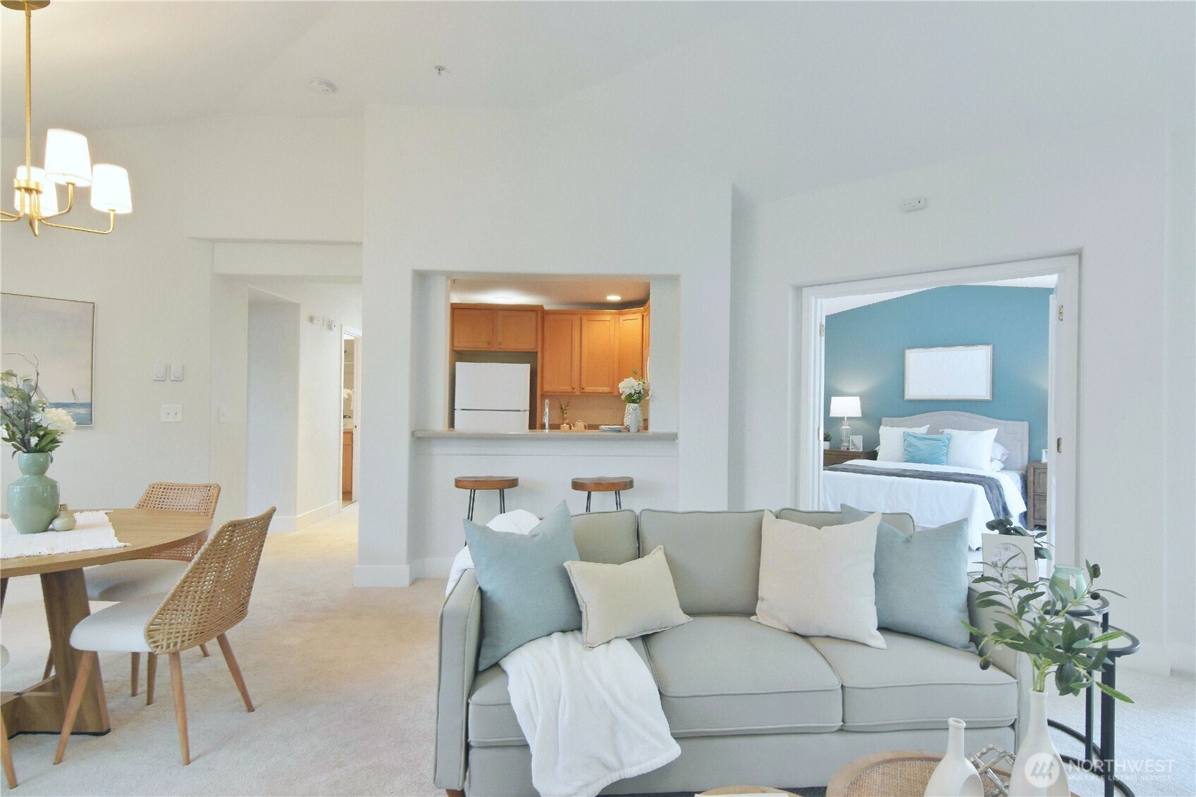 8500 Main Street, Unit F313 Edmonds, WA 98026 - Photo 8 of 24 a living room with furniture and a wooden floor