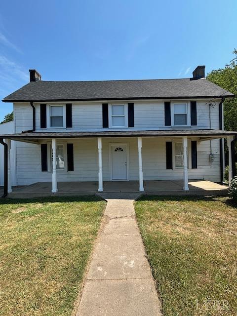 338 Ferry Road Danville, VA 24541 - Photo 2 of 34 a front view of a house with garden