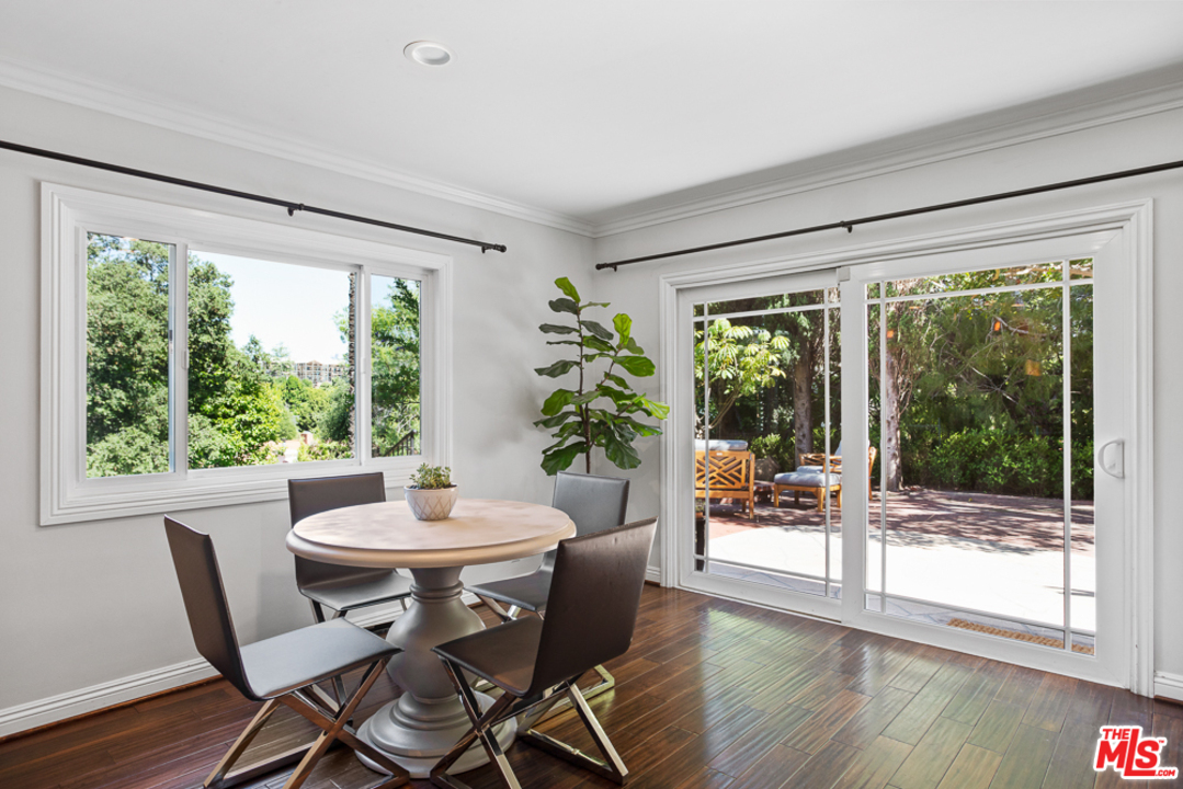 70 Club Road Pasadena, CA 91105 - Photo 11 of 38 a dining room with furniture window and wooden floor