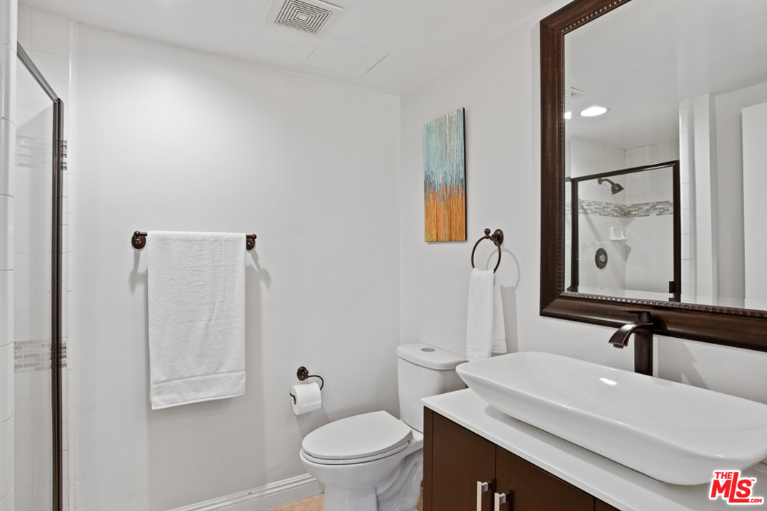 70 Club Road Pasadena, CA 91105 - Photo 14 of 38 a bathroom with a sink a toilet and shower