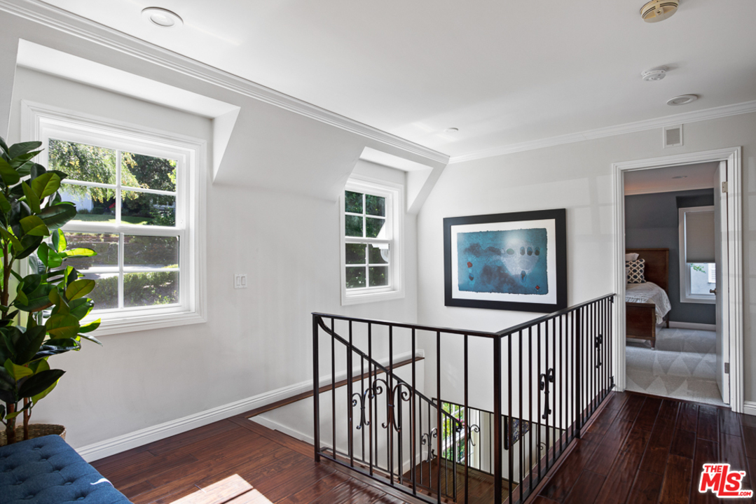70 Club Road Pasadena, CA 91105 - Photo 16 of 38 a view of staircase with wooden floor and a potted plant
