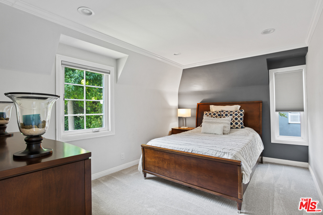 70 Club Road Pasadena, CA 91105 - Photo 17 of 38 a bedroom with a bed and window