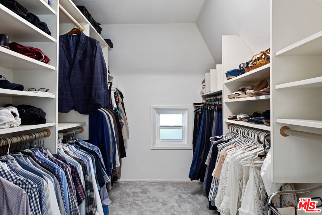 70 Club Road Pasadena, CA 91105 - Photo 24 of 38 a view of walk in closet with clothes and shoes