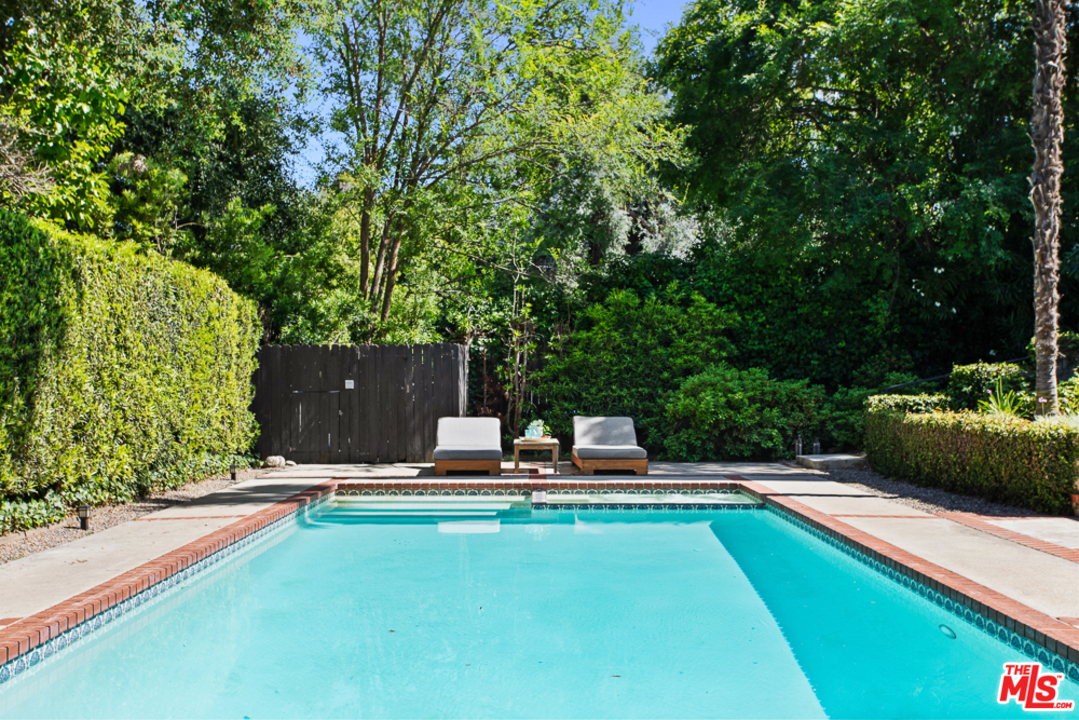 70 Club Road Pasadena, CA 91105 - Photo 32 of 38 a view of a swimming pool with chairs and garden