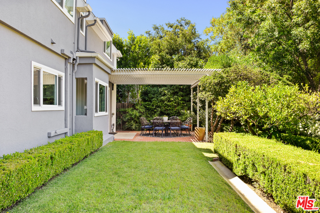 70 Club Road Pasadena, CA 91105 - Photo 7 of 38 a view of a chair and table in backyard of the house