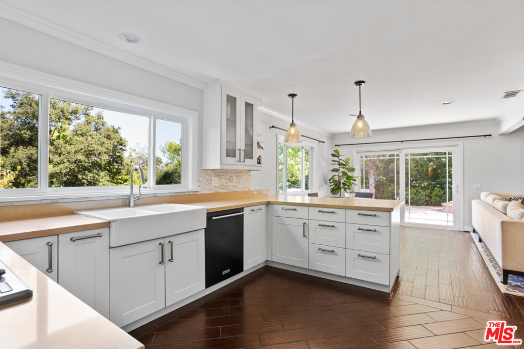 70 Club Road Pasadena, CA 91105 - Photo 10 of 38 a kitchen with sink cabinets and wooden floor
