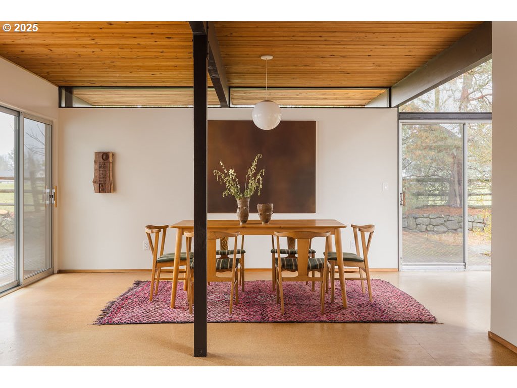 2720 Northwest Forest Avenue Beaverton, OR 97006 - Photo 14 of 40 a view of a dining room with furniture window and wooden floor