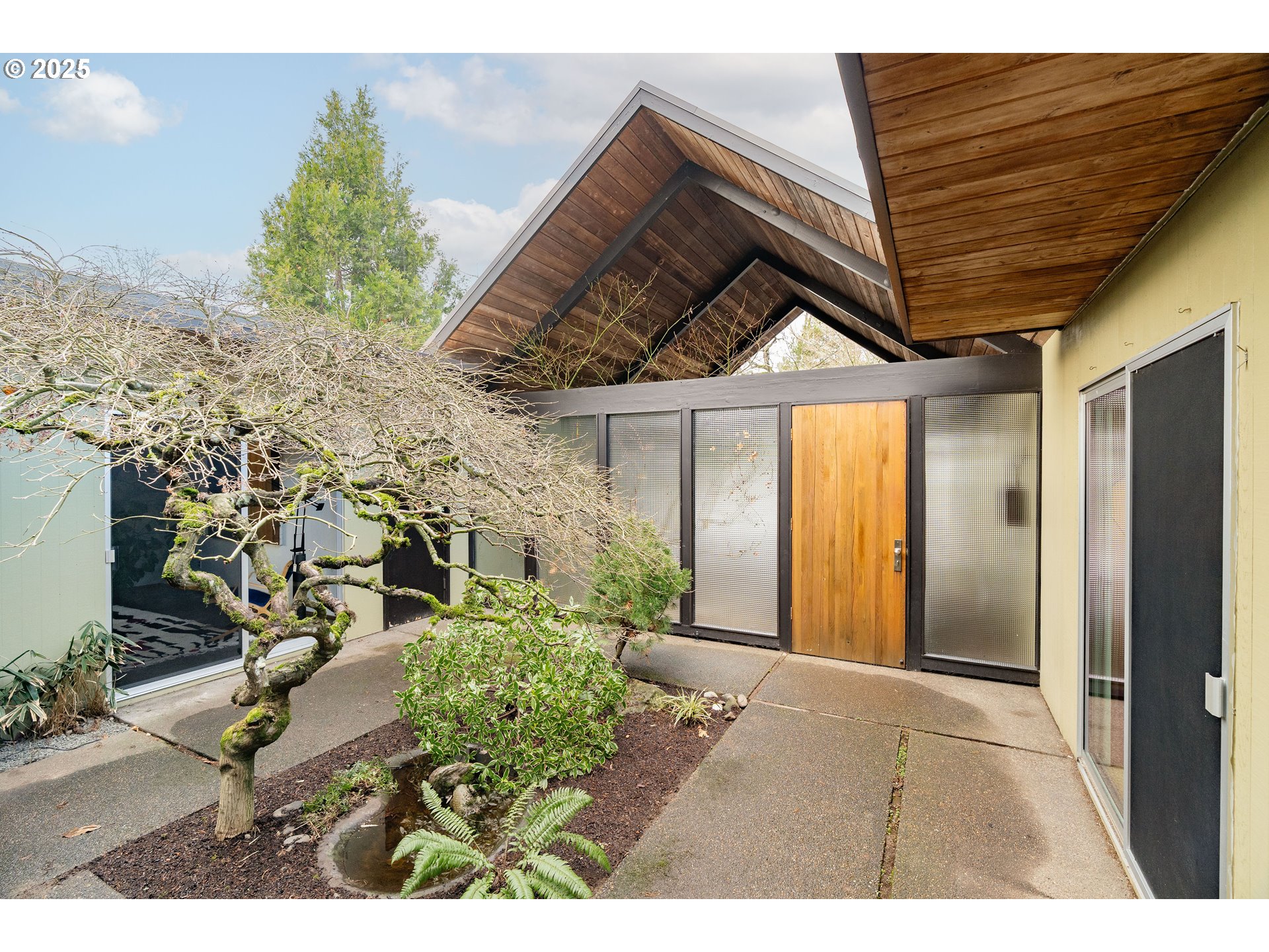 2720 Northwest Forest Avenue Beaverton, OR 97006 - Photo 2 of 40 a house view with a garden