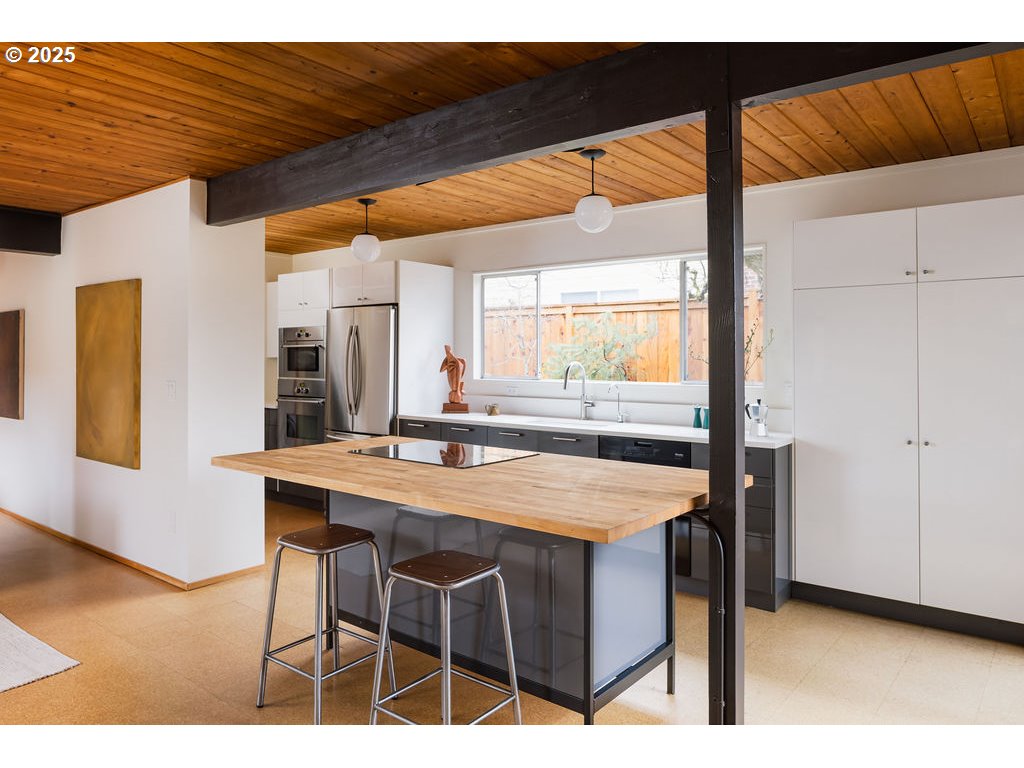 2720 Northwest Forest Avenue Beaverton, OR 97006 - Photo 21 of 40 a dining table chair with a large window