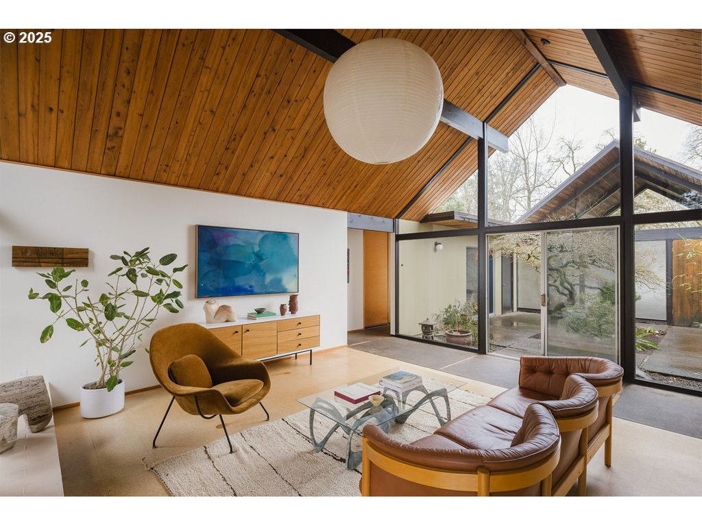 2720 Northwest Forest Avenue Beaverton, OR 97006 - Photo 6 of 40 a living room with furniture a table and a large window