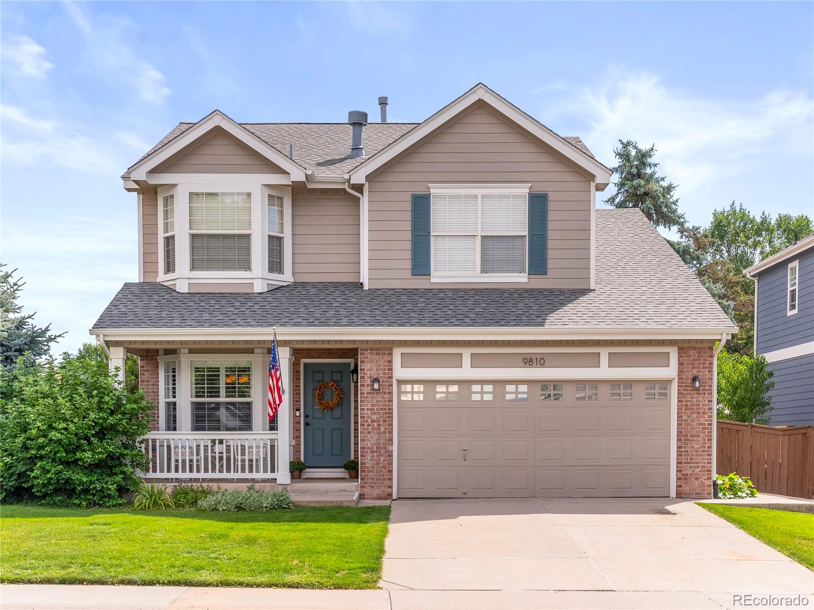 9810 Mulberry Way Highlands Ranch, CO 80129 - Photo 1 of 49 front view of a house and a yard