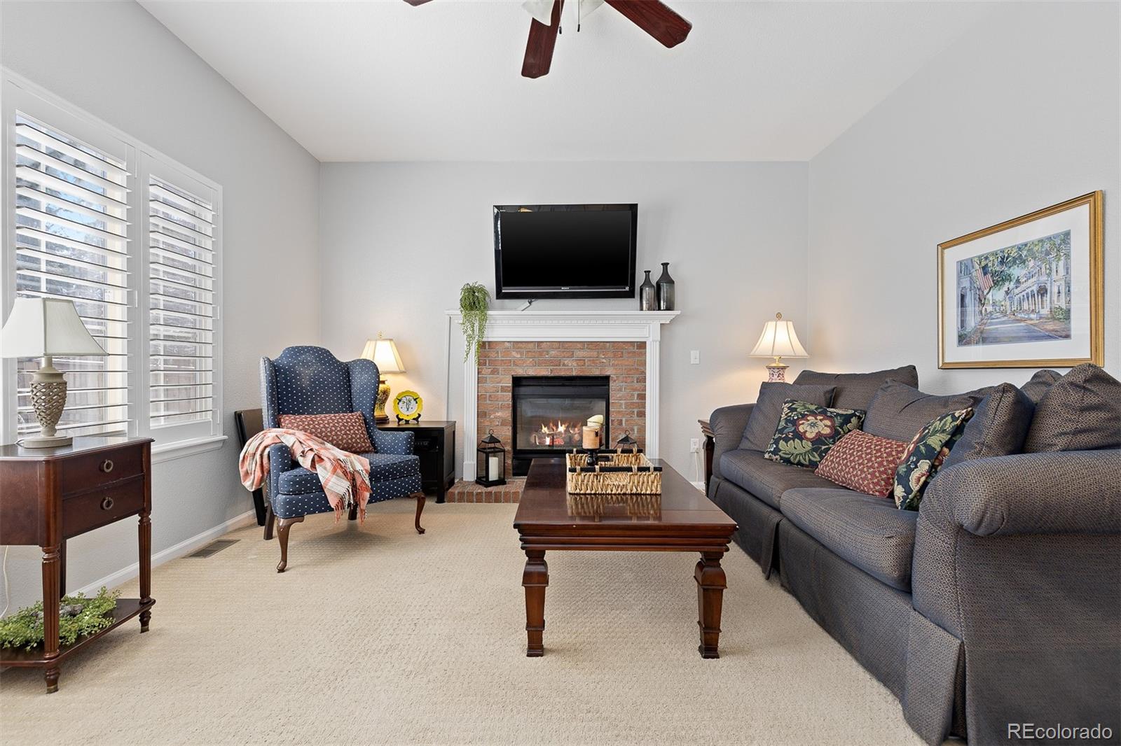 9810 Mulberry Way Highlands Ranch, CO 80129 - Photo 19 of 49 a living room with furniture fireplace and flat screen tv