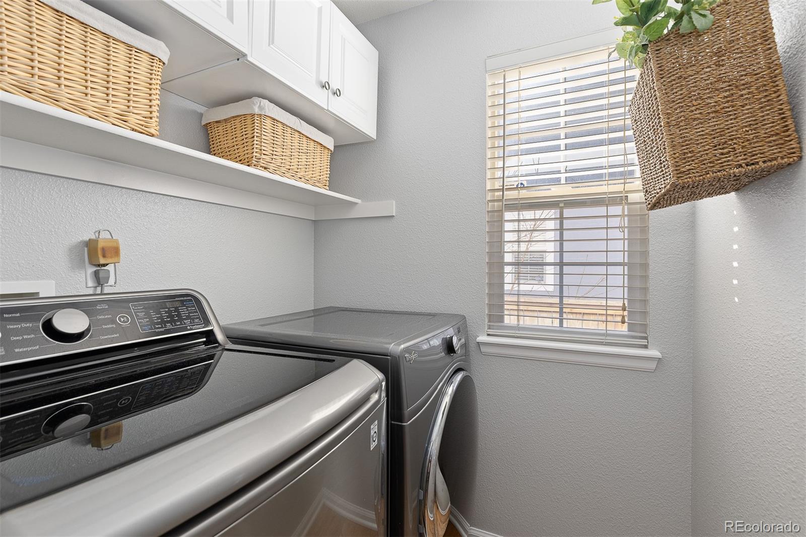9810 Mulberry Way Highlands Ranch, CO 80129 - Photo 21 of 49 a utility room with dryer and washer