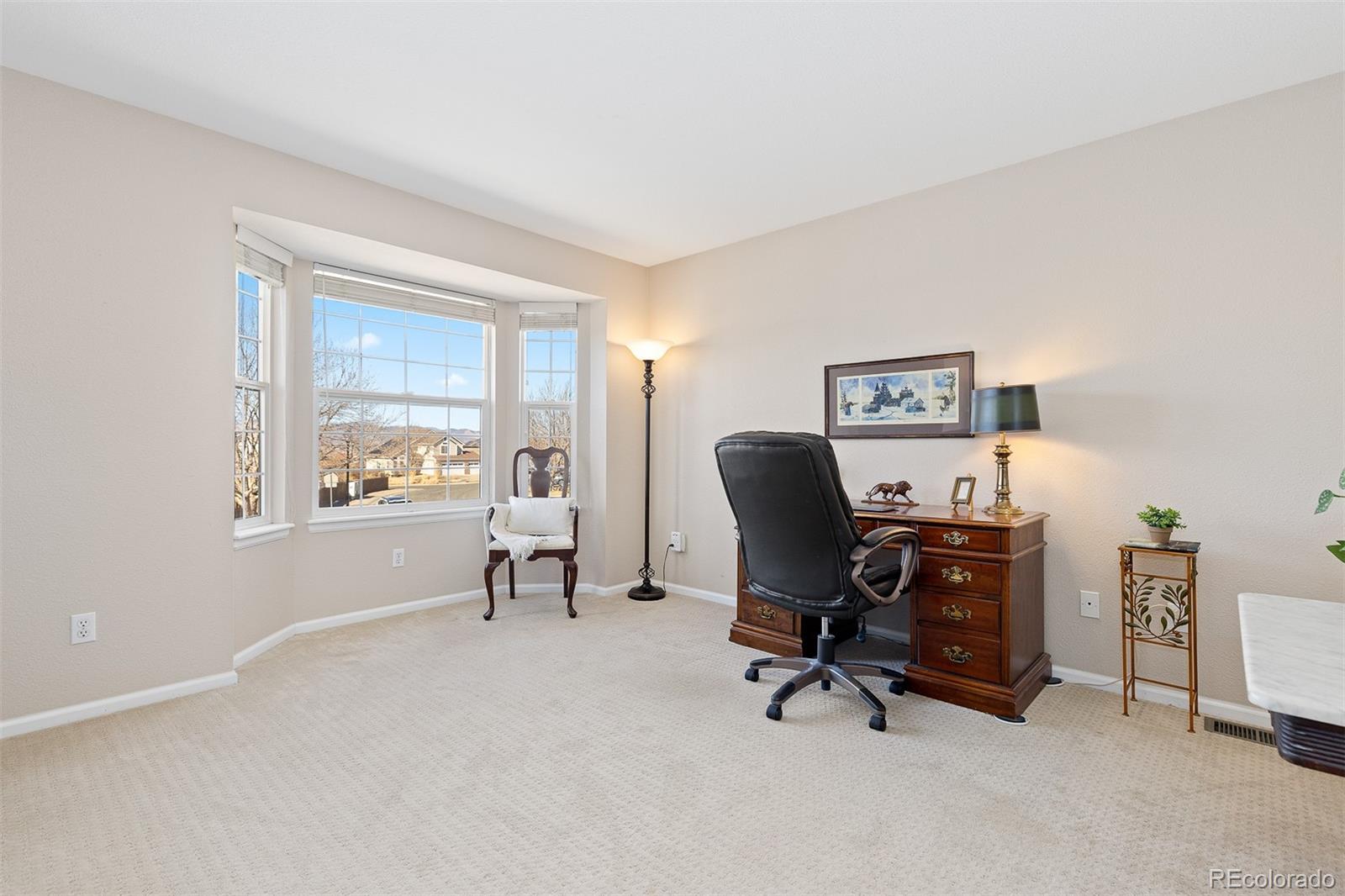 9810 Mulberry Way Highlands Ranch, CO 80129 - Photo 27 of 49 a view of a workspace with furniture and a window
