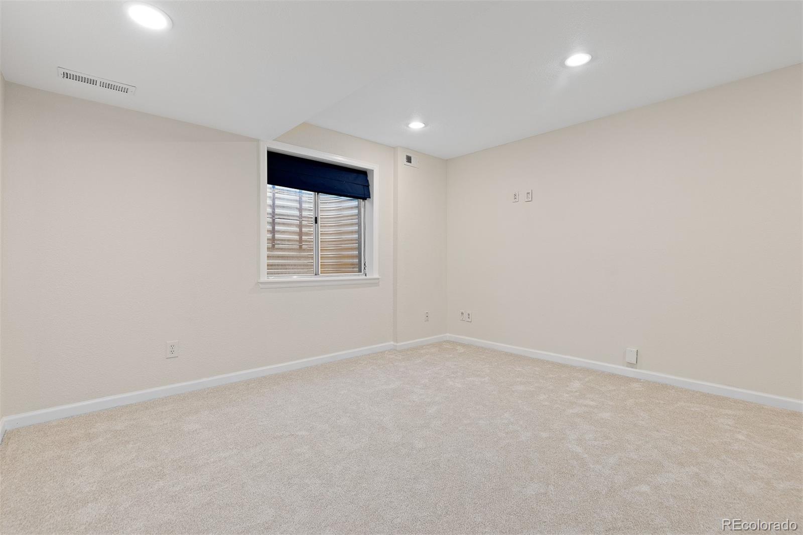 9810 Mulberry Way Highlands Ranch, CO 80129 - Photo 34 of 49 an empty room with windows