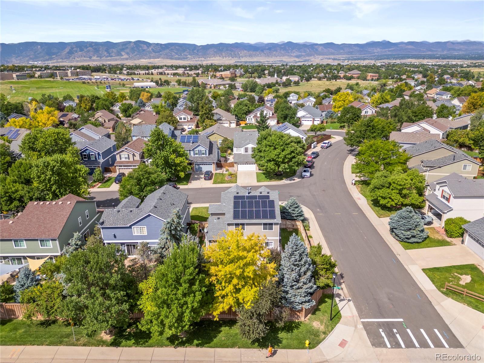 9810 Mulberry Way Highlands Ranch, CO 80129 - Photo 40 of 49 an aerial view of a house with a lake