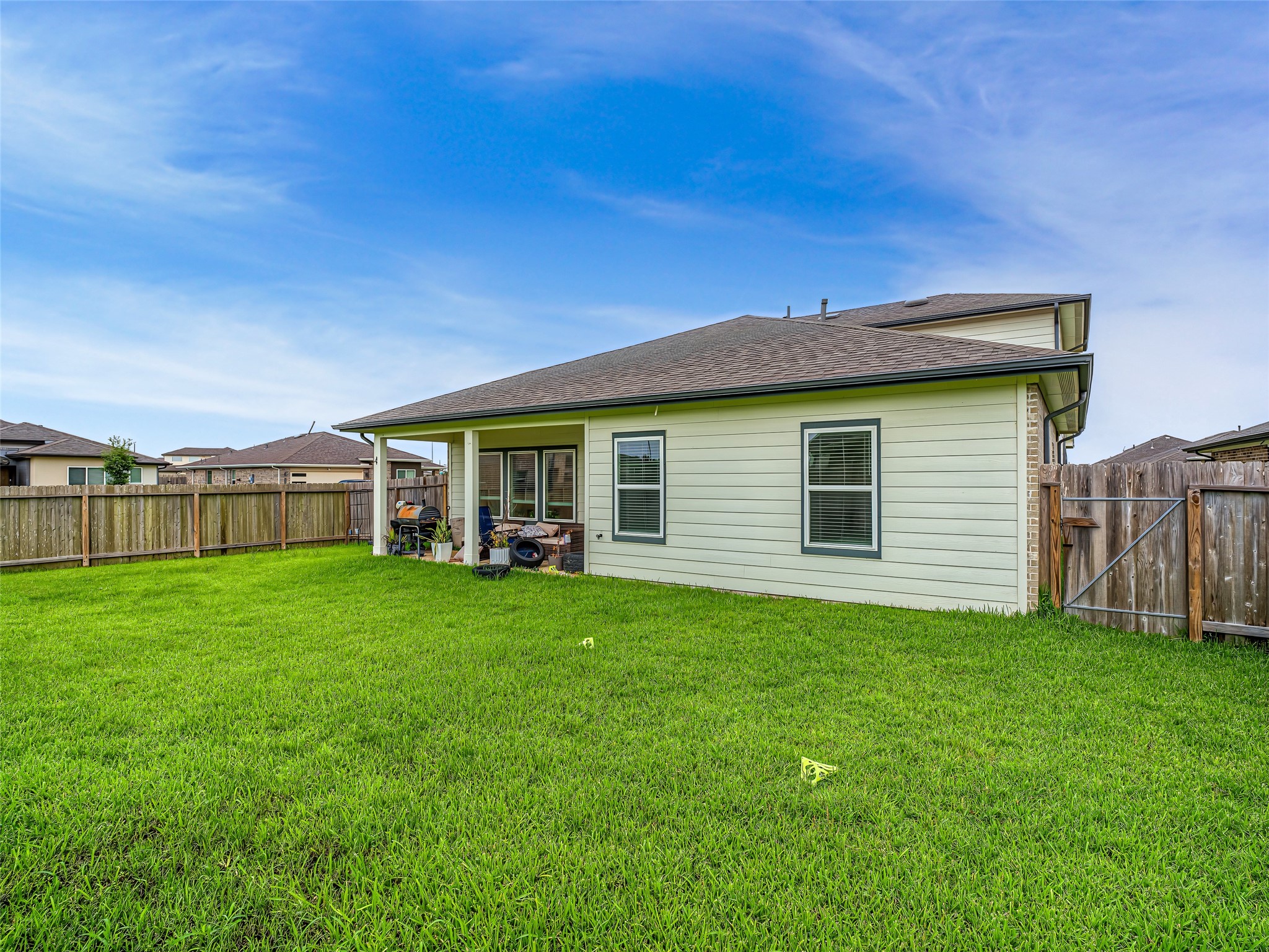 8043 Milam Lane Rosharon, TX 77583 - Photo 33 of 41 Combining exceptional privacy with seamless indoor-outdoor convenience, this inviting backyard is absolutely ready to fulfill all your entertainment dreams!