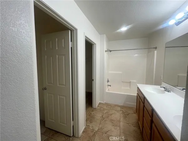 a bathroom with a bathtub and a sink