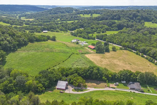 an aerial view of a residential houses with outdoor space
