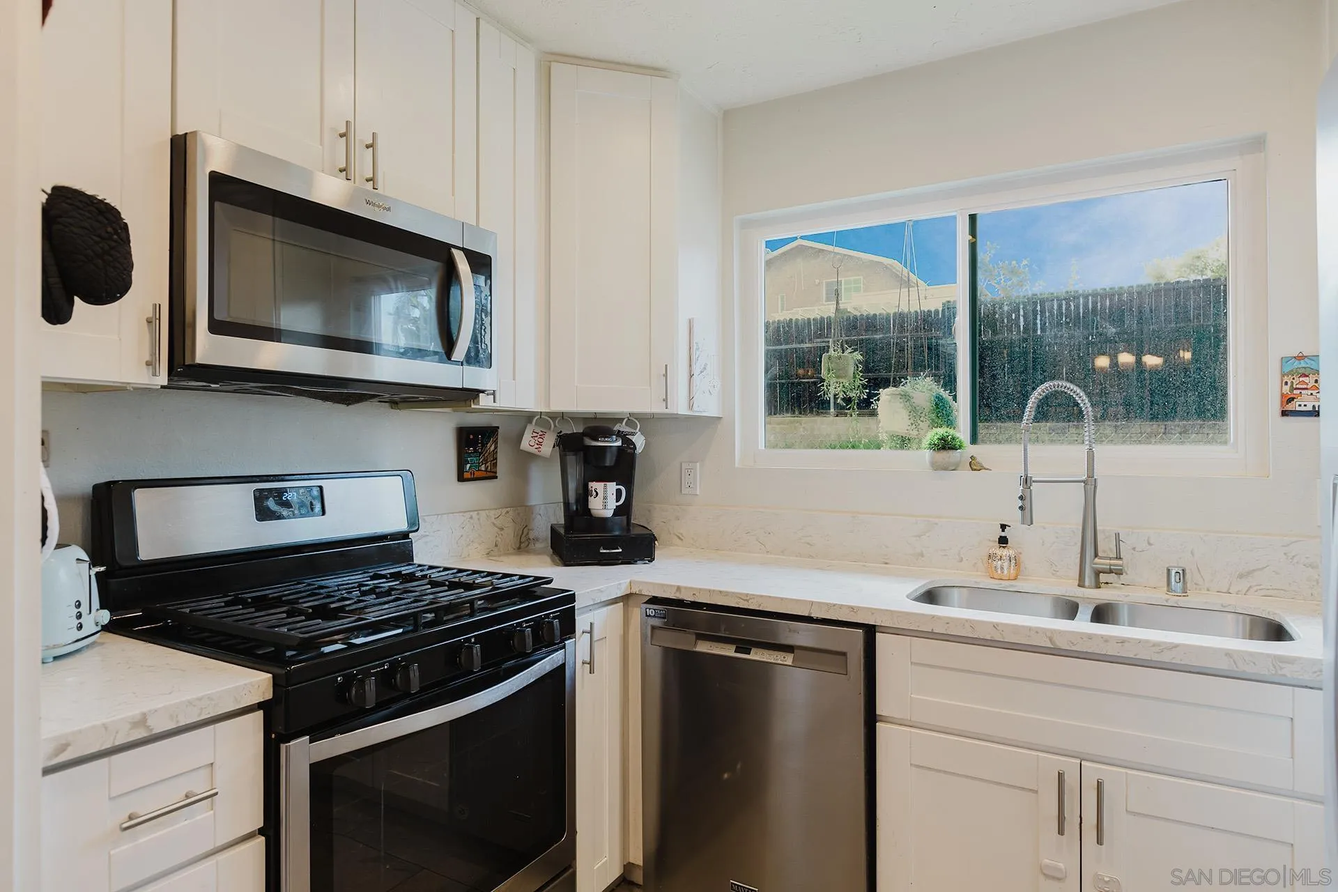 10214 Michala Place Santee, CA 92071 - Photo 12 of 25 a kitchen with a stove and a microwave