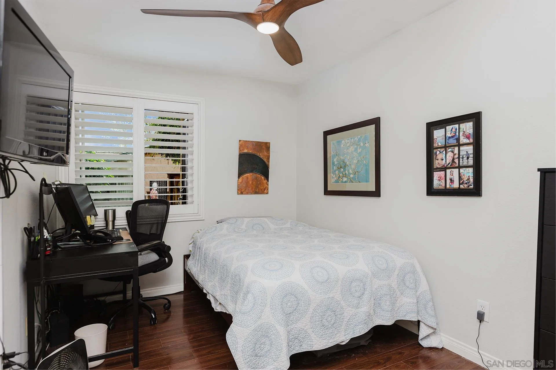 10214 Michala Place Santee, CA 92071 - Photo 14 of 25 a bedroom with a bed a desk and chair with wooden floor