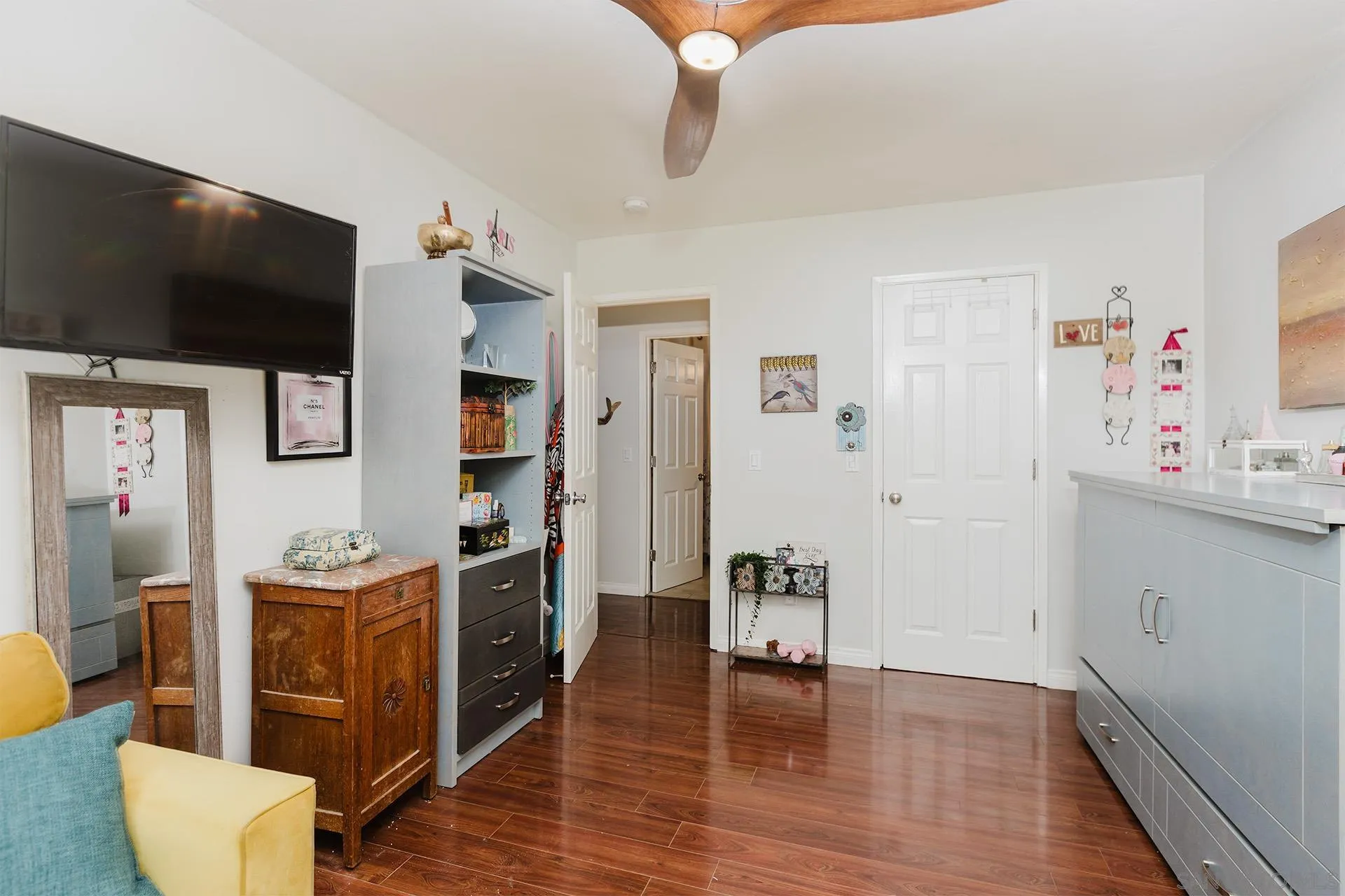 10214 Michala Place Santee, CA 92071 - Photo 17 of 25 a view of a livingroom with an empty space and a flat screen tv
