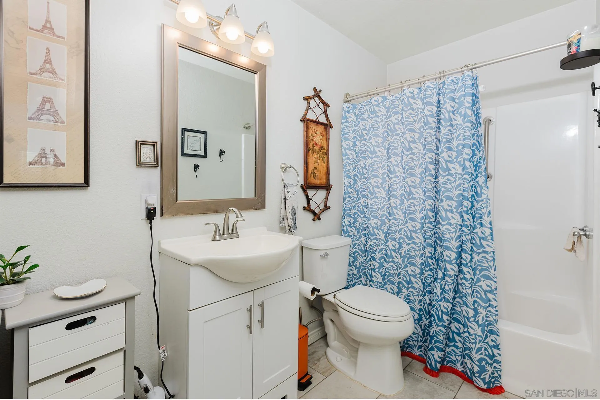 10214 Michala Place Santee, CA 92071 - Photo 18 of 25 a bathroom with a sink a toilet and shower curtain